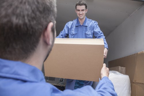 Customer using a self storage facility safely near stacked boxes