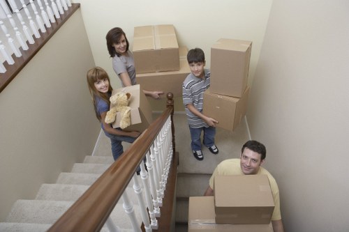 Professional movers loading items for a flat move in Stjohnswood